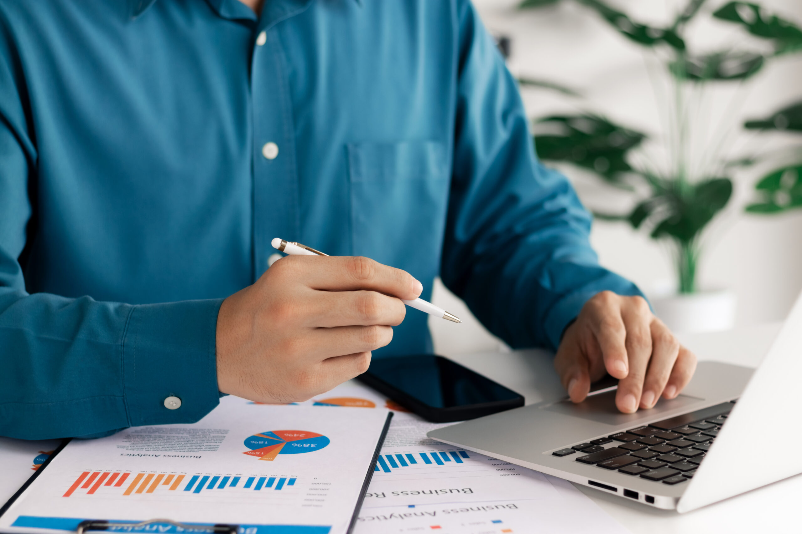 Businessman analysis business report graph and finance chart, conceptual of finance economy, stock market research and banking business.